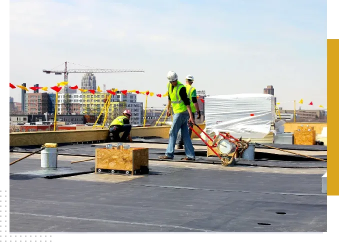 Roofers working on a flat roof.